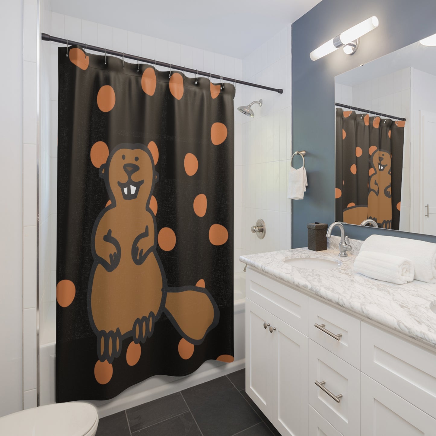Styled bathroom scene with polka dot beaver shower curtain, orange accents, and college-themed decor