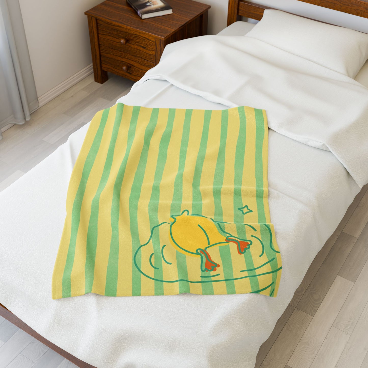 Gift-ready duck blanket with quirky “buns up” design and dopamine decor styling