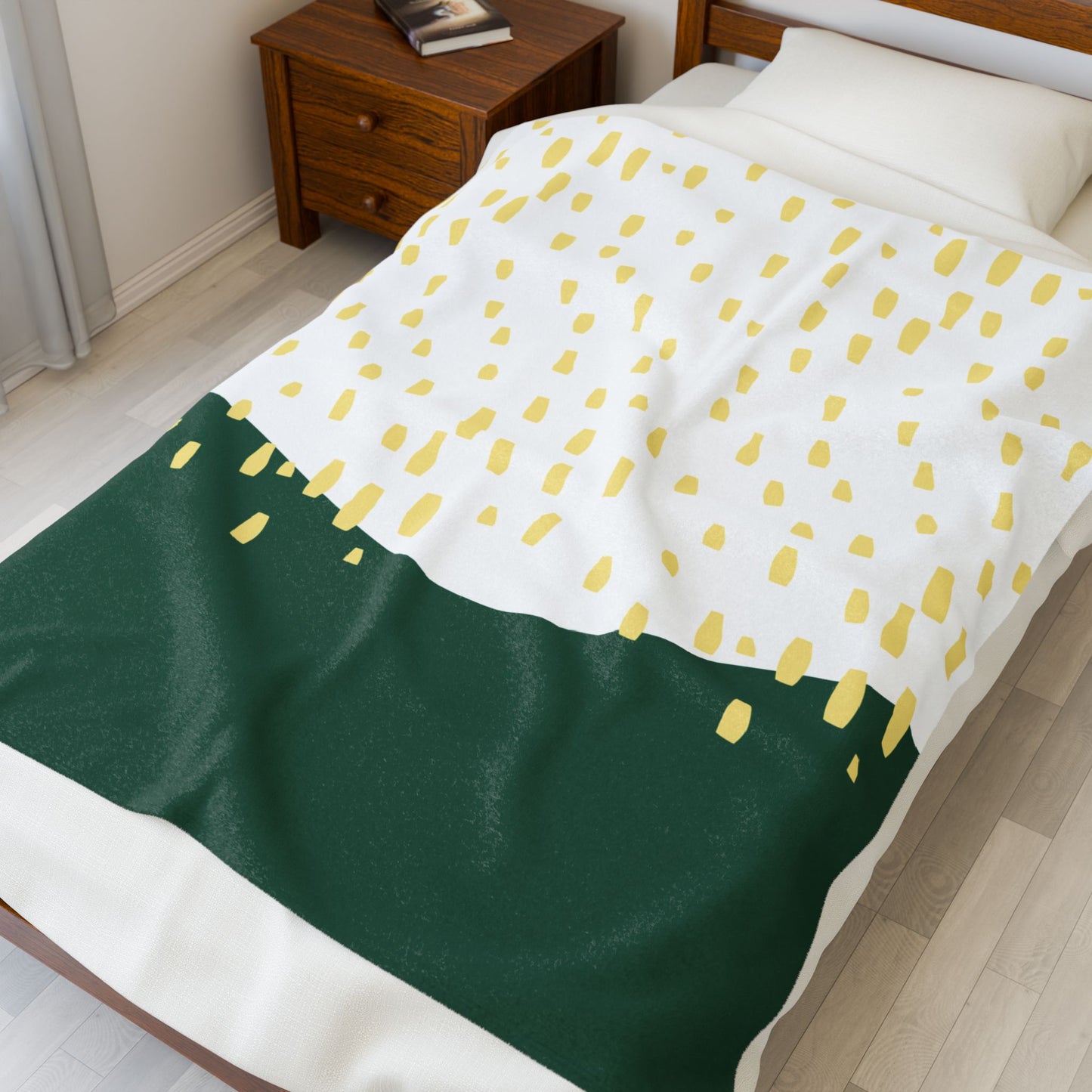 Folded rain-themed plush blanket in soft retro palette for cozy dorm moments