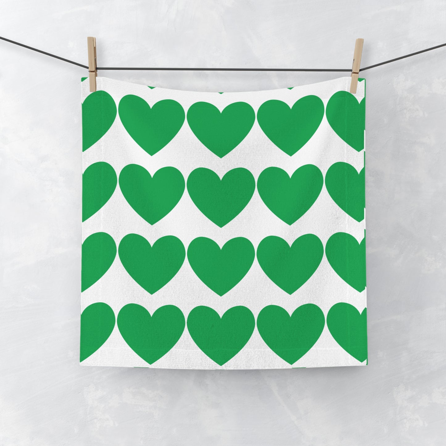 Green face towel with soft heart accents for college dorm bathroom decor