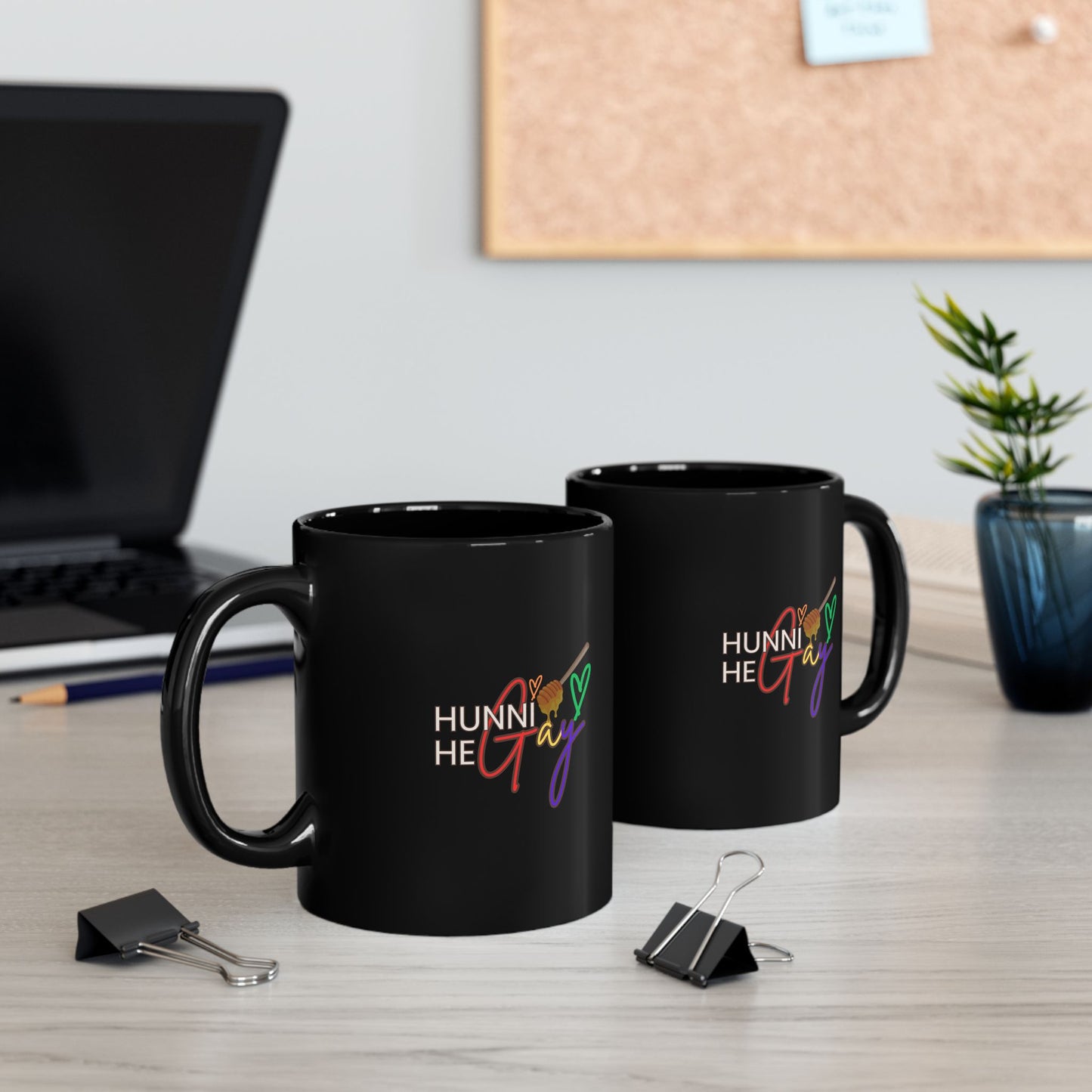 Bold black coffee mug with “Hunni He Gay” in playful typography, celebrating Pride and LGBTQ+ identity.