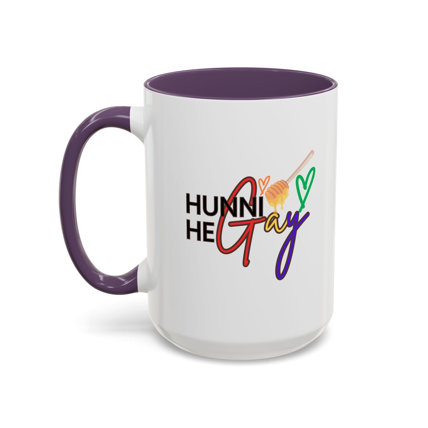 White ceramic coffee cup with "Hunni He Gay" in vibrant rainbow text, complemented by a bold purple handle and rim, adding a playful Pride touch.