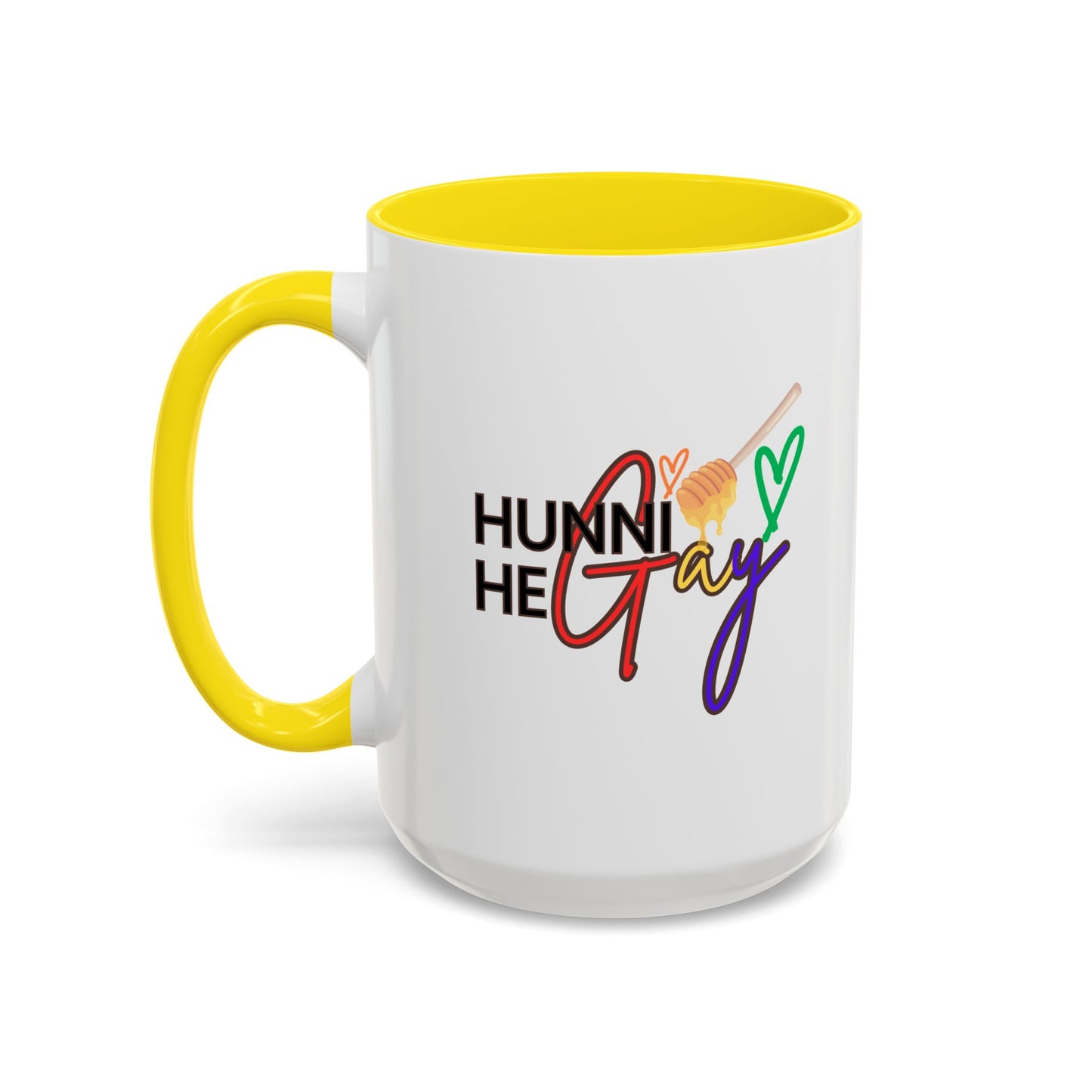White ceramic coffee cup featuring "Hunni He Gay" in bold rainbow lettering, accented with a vibrant yellow rim and handle for a cheerful Pride-inspired design.