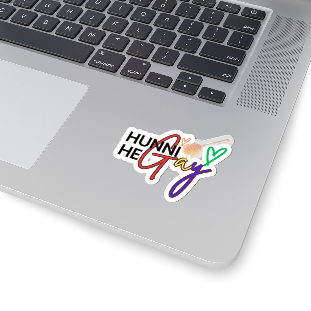 A funky Pride sticker featuring "Hunni He Gay" in a wavy retro font with layered neon rainbow effects.