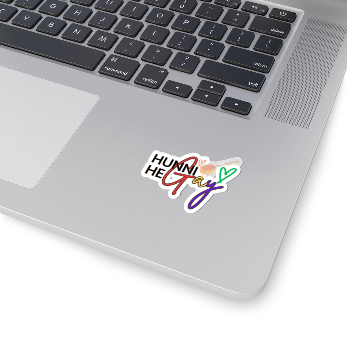 Glossy die-cut sticker with "Hunni He Gay" in bold, bubbly lettering, radiating LGBTQ+ pride and energy.