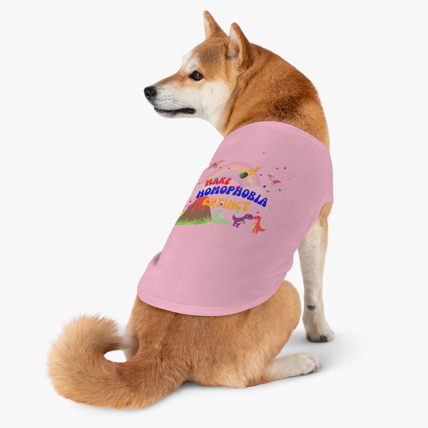 Soft pink LGBTQ+ t-shirt with a charming dinosaur and a dog, perfect for spreading love and inclusivity.featuring “Make Homophobia Extinct”