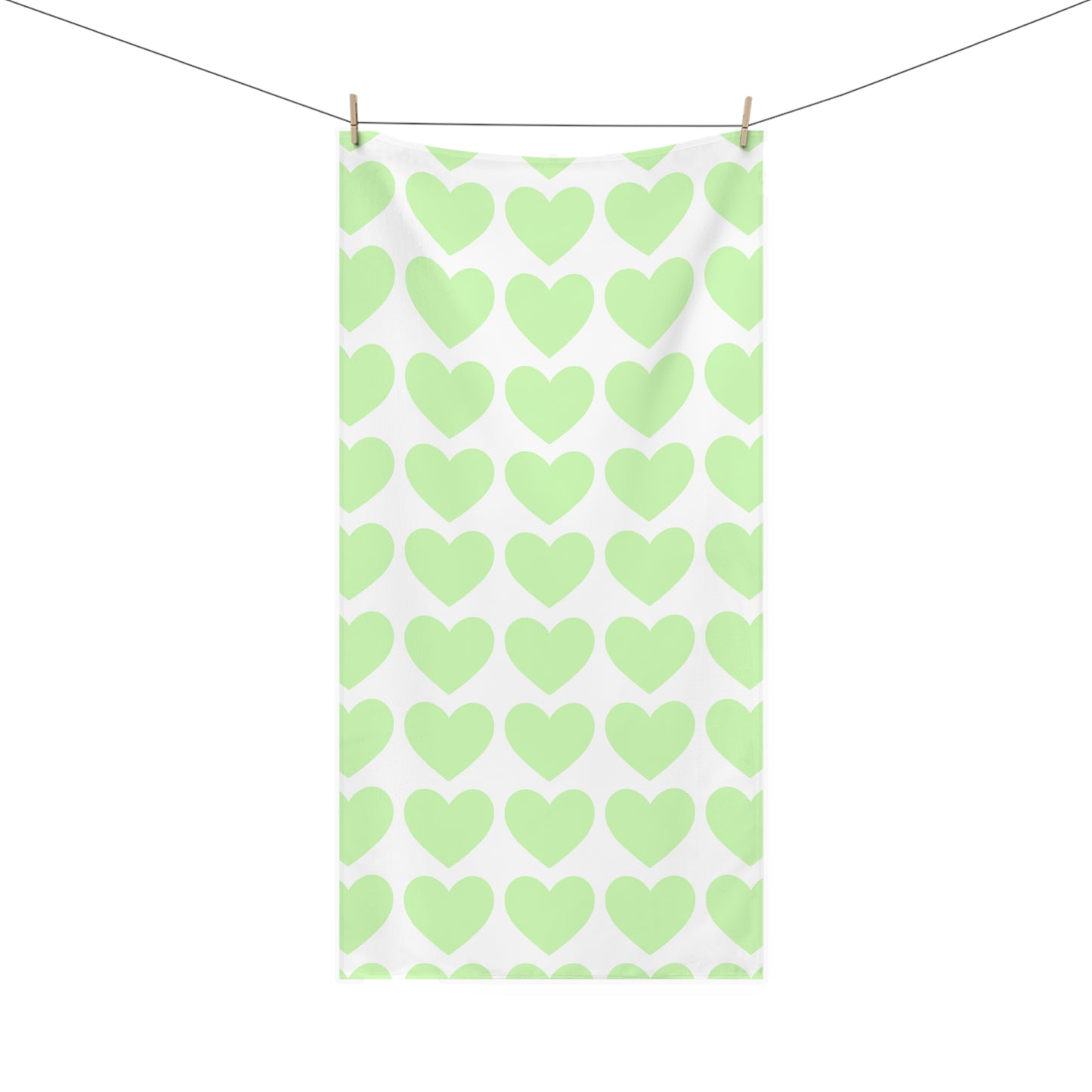 Bathroom towel featuring scattered mint green hearts – soft and whimsical decor for cozy self-care moments