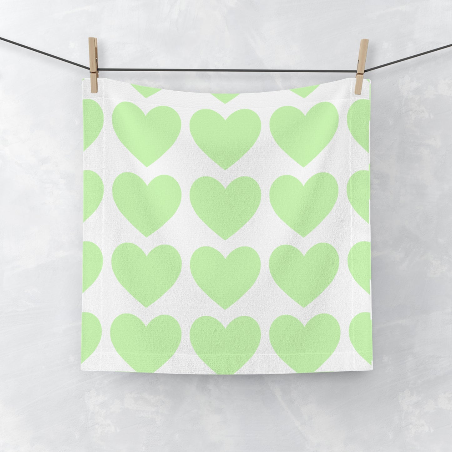 Mint face towel with heart accents, perfect for college dorm bathroom style
