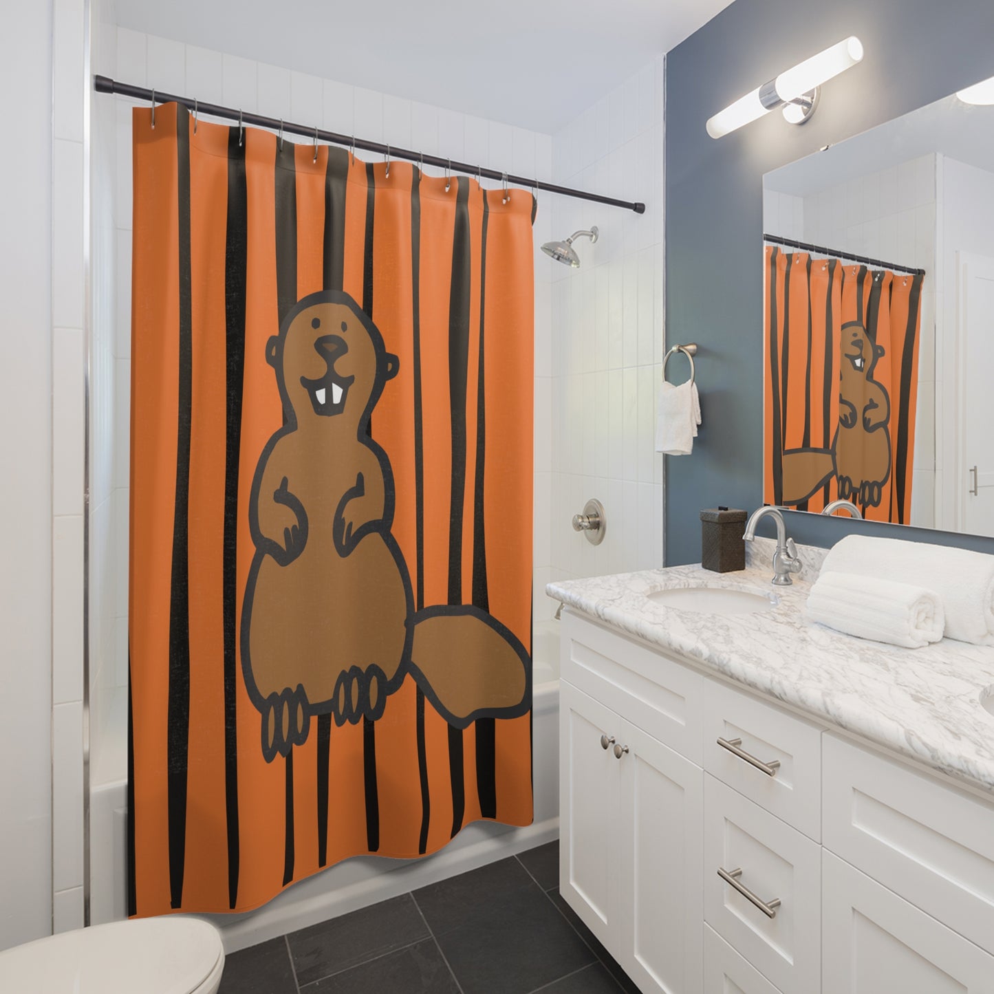 Styled bathroom scene featuring striped beaver shower curtain with modern fixtures and wood accents