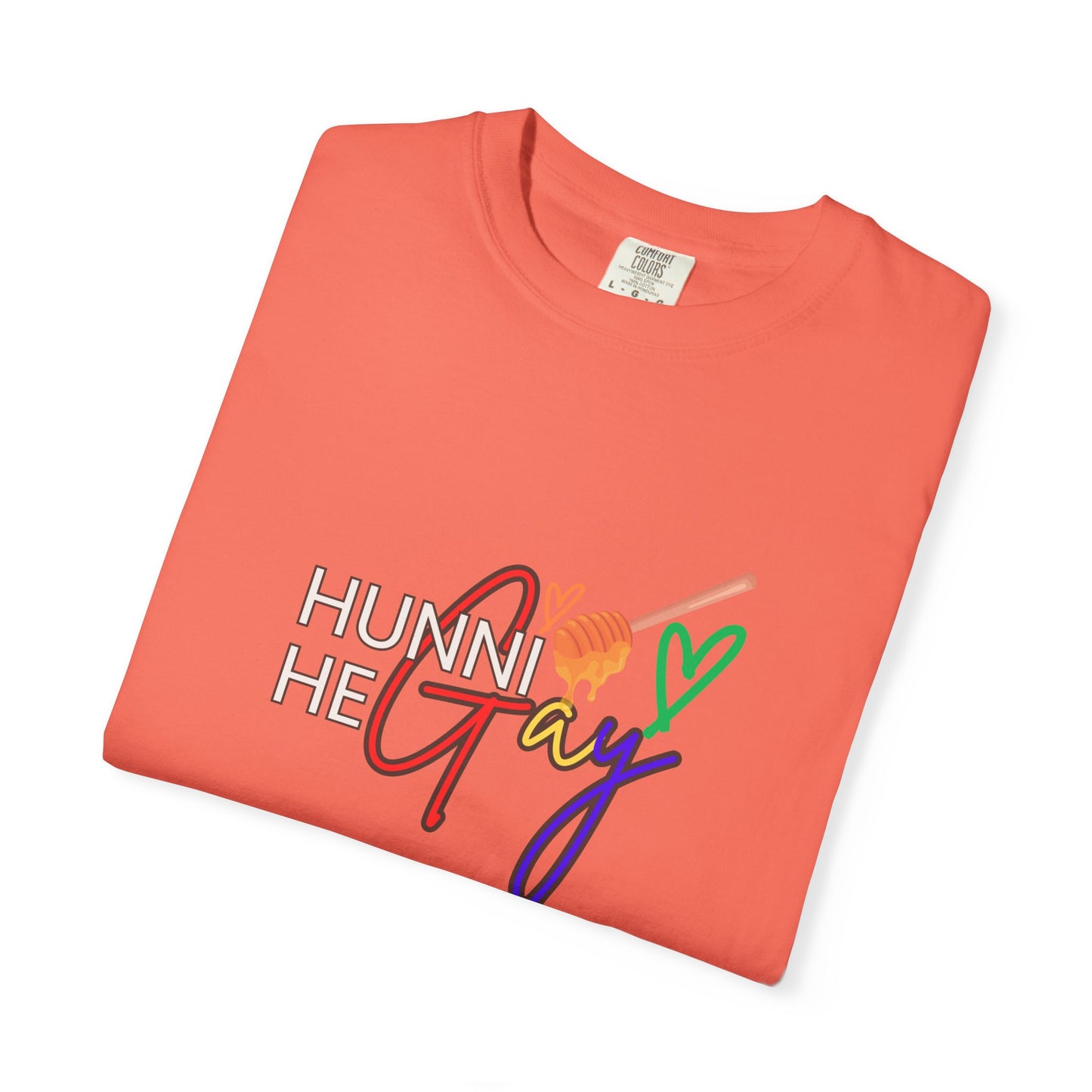 Pastel peach-pink crew-neck t-shirt featuring “Hunni He Gay” in standout typography—bright, fresh, and full of self-expression.