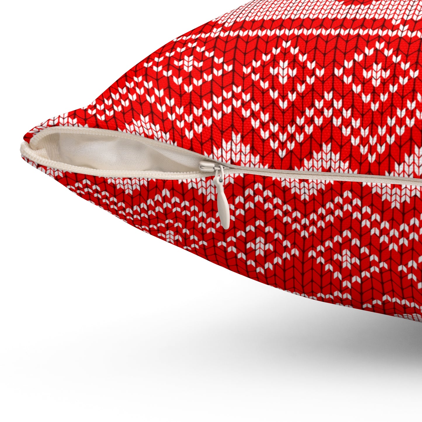 Close-up of hidden zipper closure on back of red holiday pillow with white trim and soft fabric finish