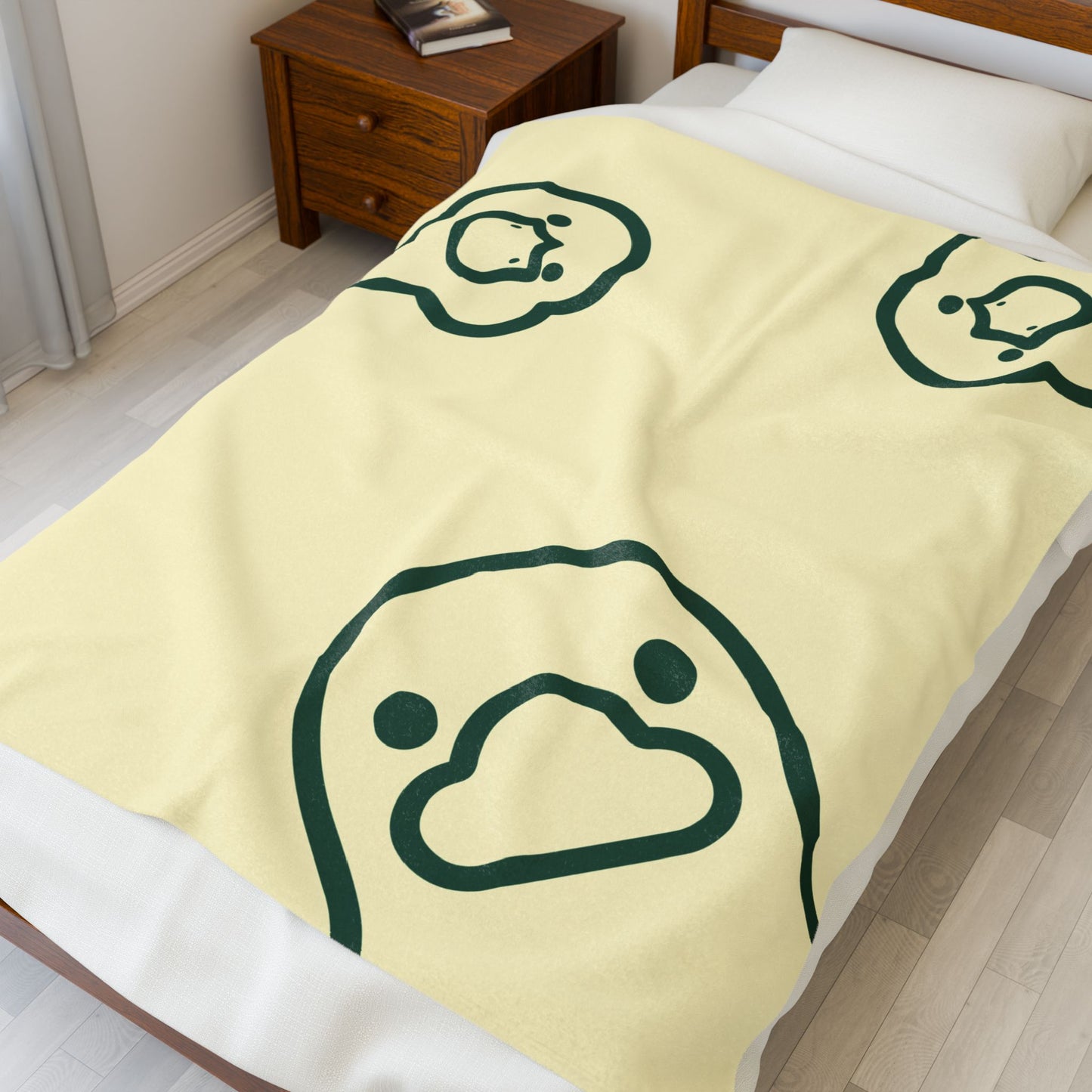 Soft yellow college blanket styled on dorm bed with cozy bedroom accessories