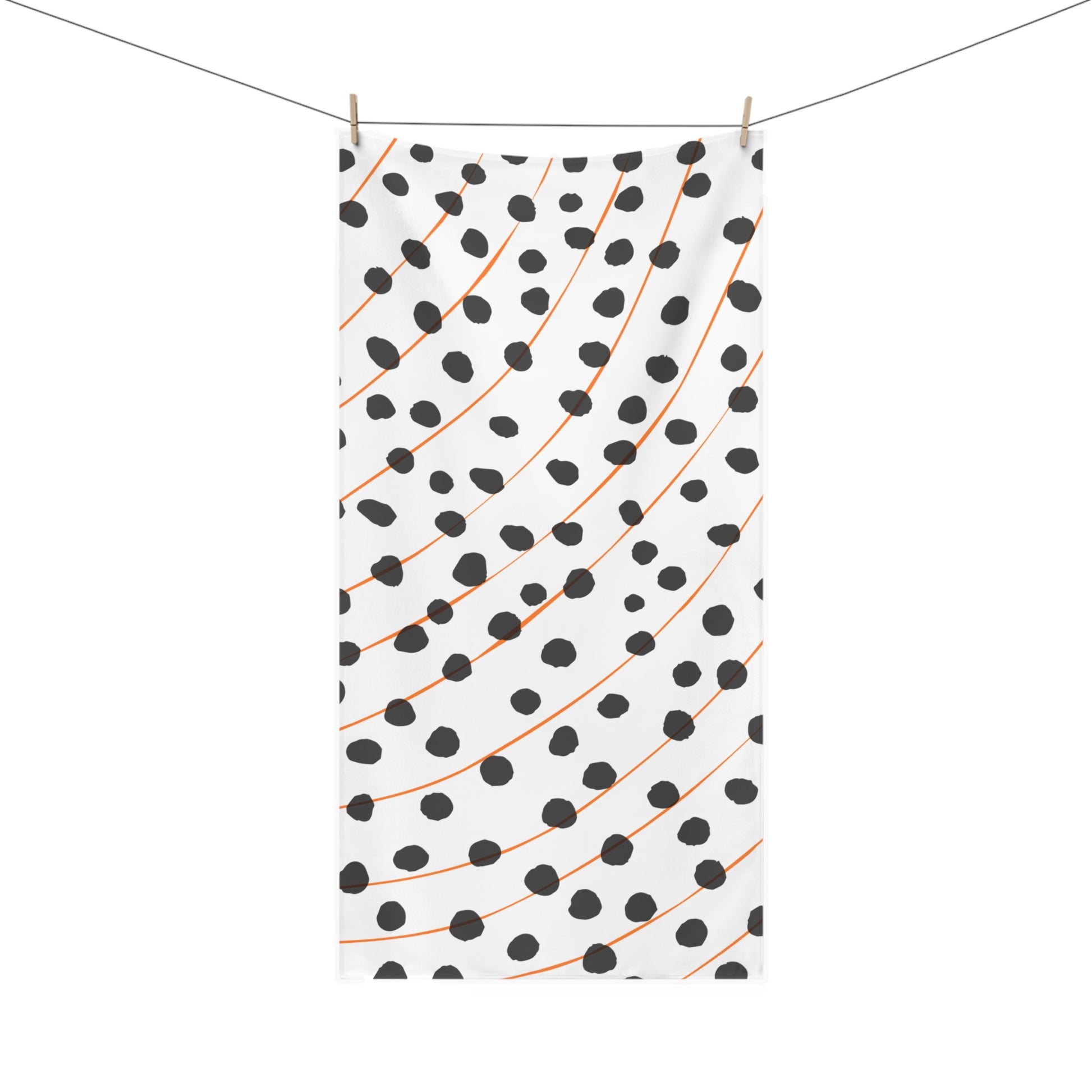 Close-up of rain pattern on orange and black towel