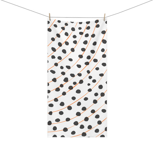 Close-up of rain pattern on orange and black towel