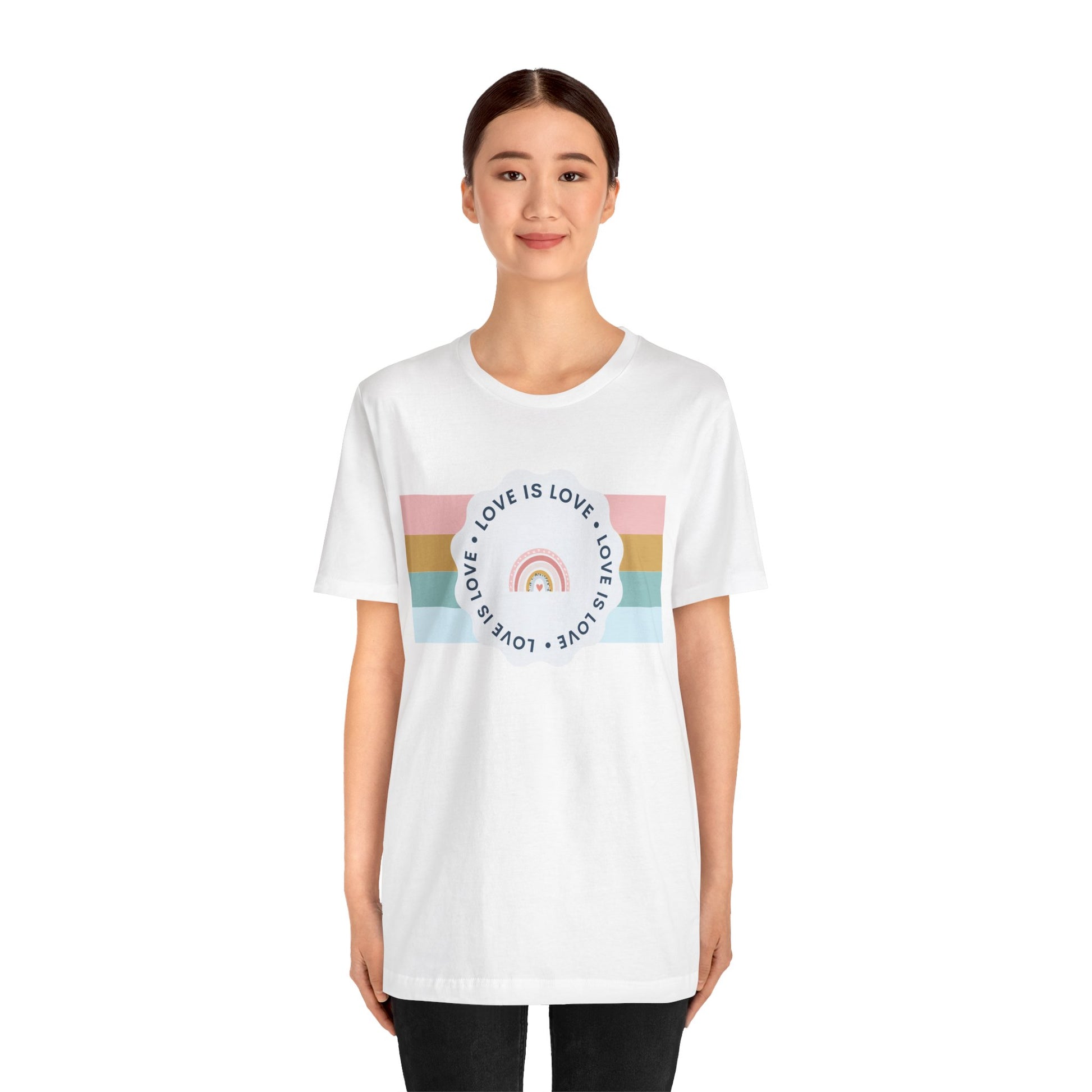 Classic white Pride T-shirt showcasing colorful “Love Is Love” lettering—playful, inclusive, and ideal for Pride festivities.