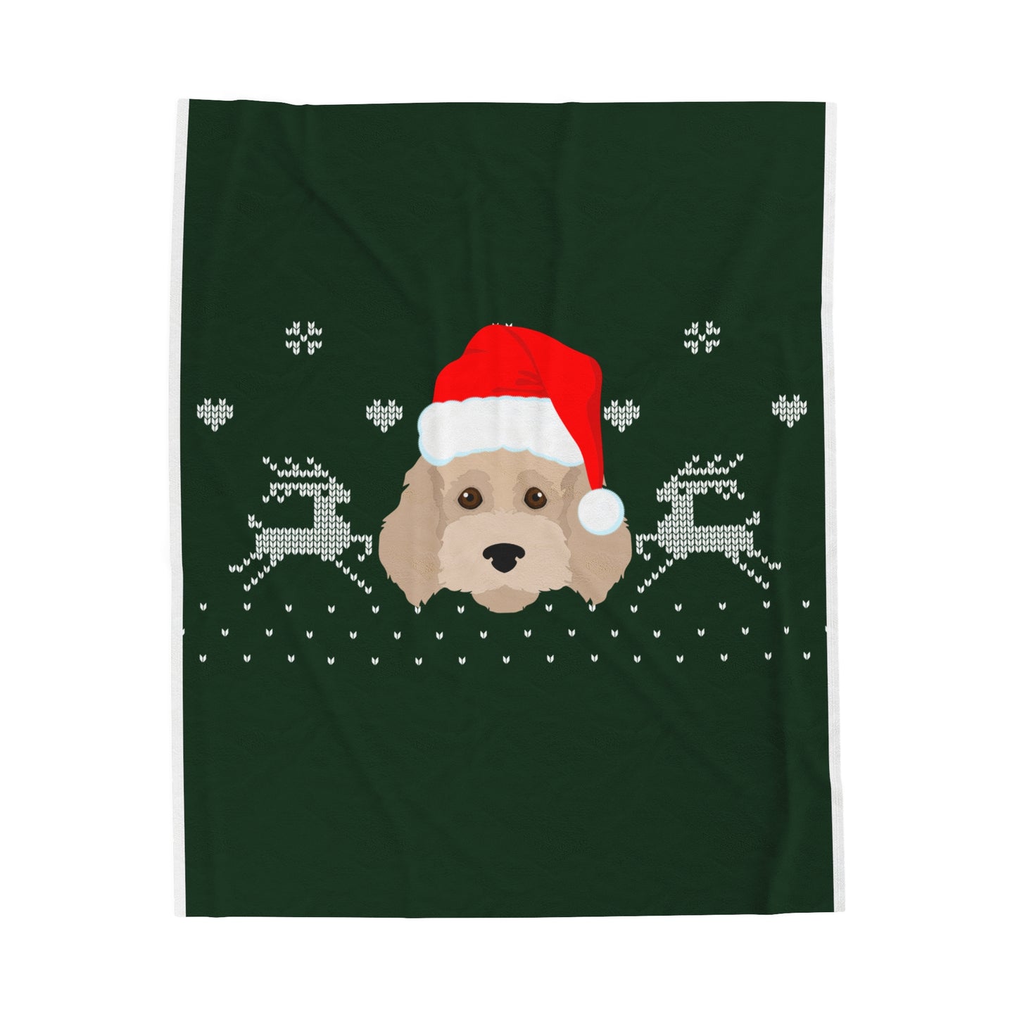 Flat lay of holiday blanket with Cockapoo in Santa hat design on soft green or red fabric surrounded by festive props