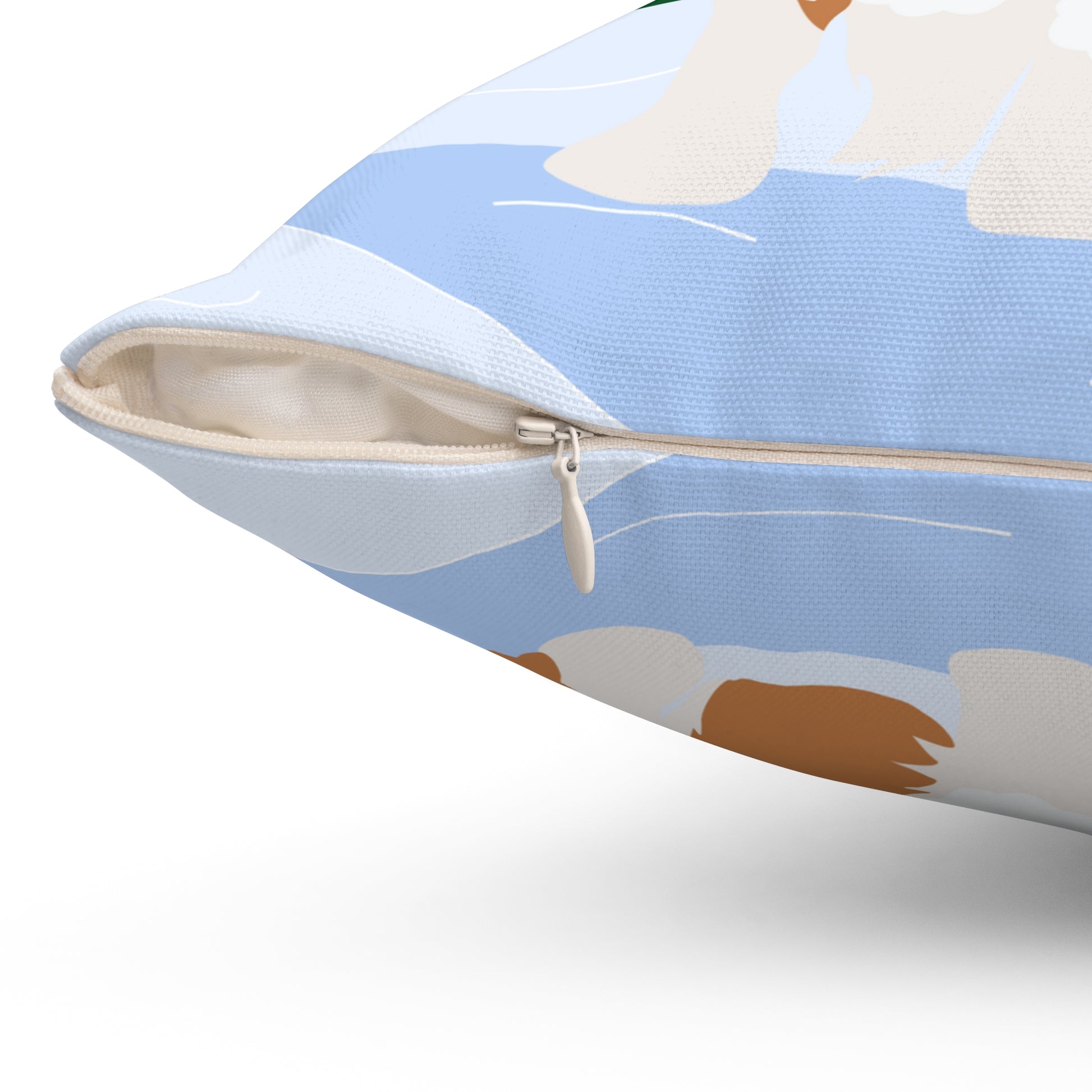 Close-up of zipper closure on back of Christmas corgi pillow showing fabric texture and stitching detail