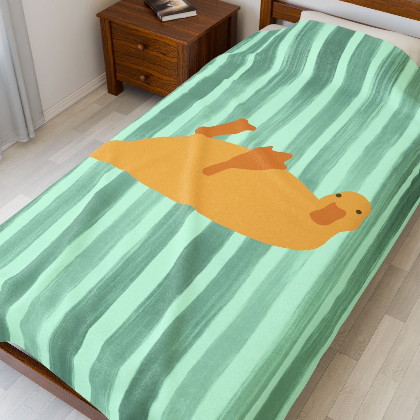 Folded green striped blanket for bed rot days and self-care moments