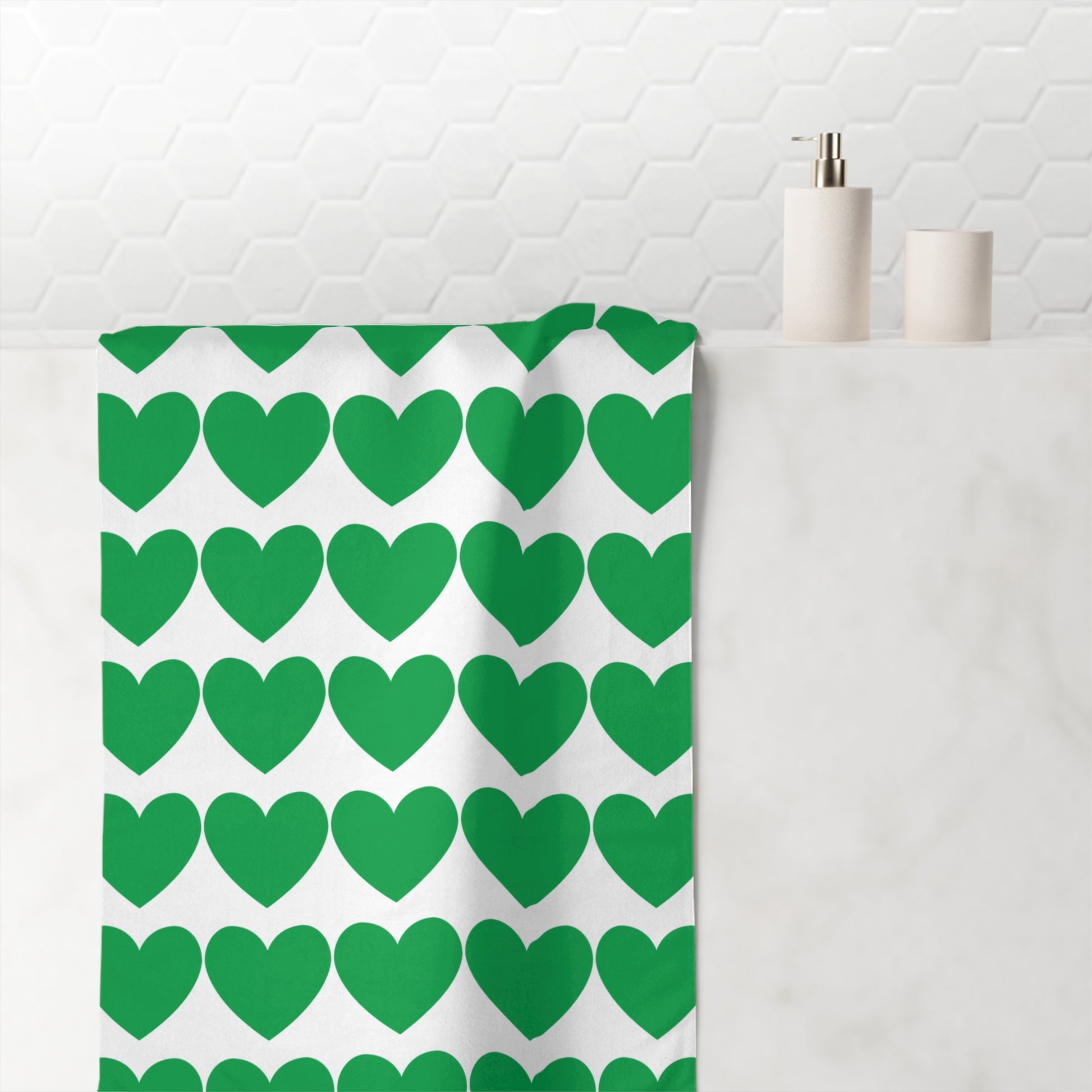 Green towel with subtle heart pattern – charming bathroom accessory with expressive style