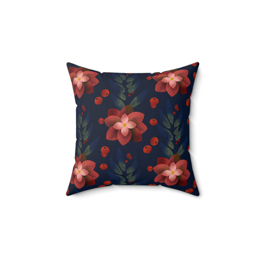Flat lay of elegant blue holiday pillow with silver poinsettia floral embroidery on soft velvet-like fabric