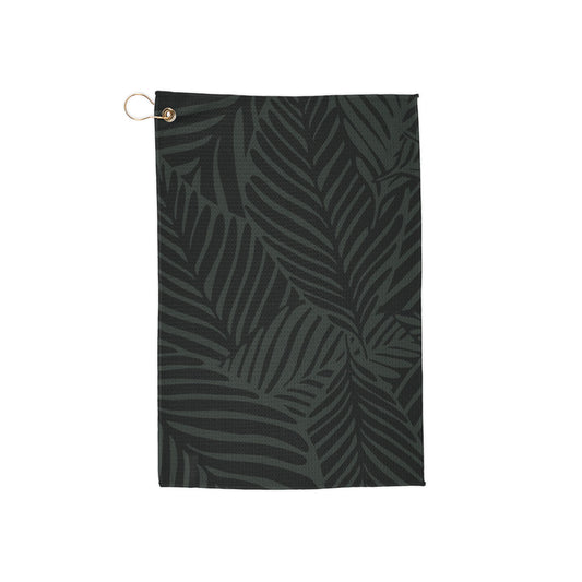 A moody, rich-toned golf towel covered in deep green jungle leaves for an earthy, tropical aesthetic. Stylish and effortlessly cool.
