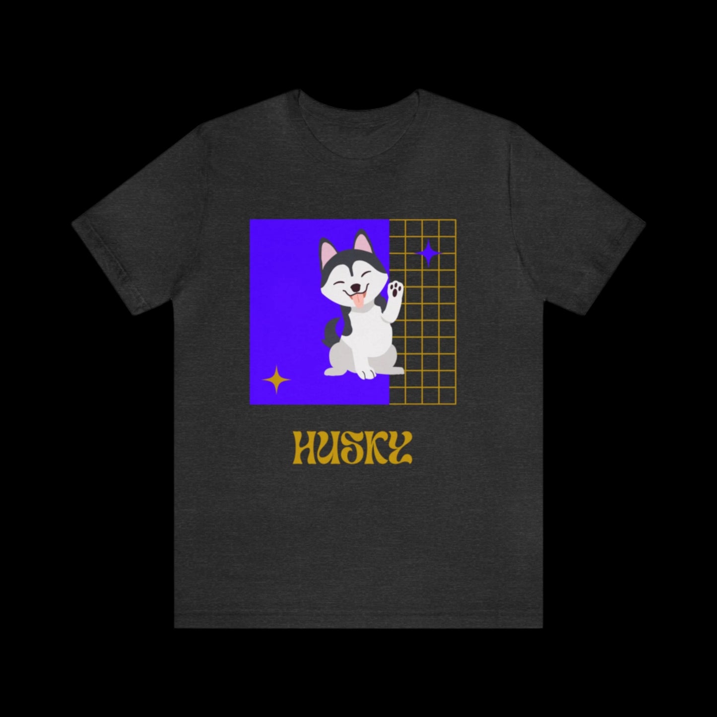 Model wearing dark heather gray t-shirt with purple and gold mascot, lounging on a picnic blanket with layered loungewear and sneakers.
