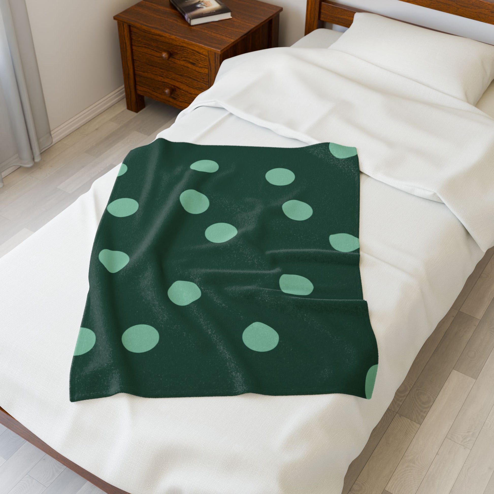 Gift-ready blanket with retro green polka dot theme styled for dopamine dorm care package