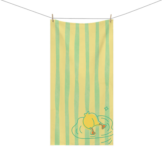 Bathroom towel featuring duck dive design across green and gold stripes – retro decor with quirky college-friendly flair