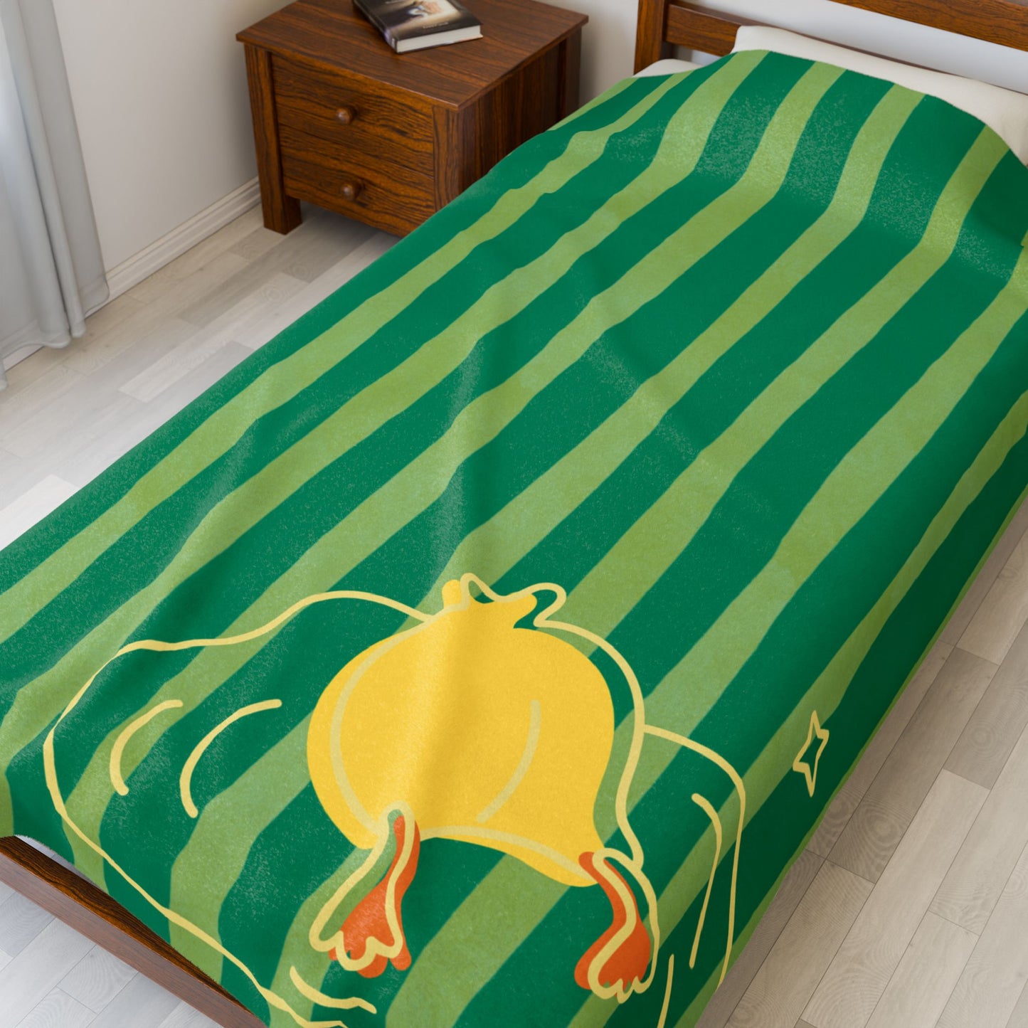 Close-up of plush blanket texture and whimsical duck print on striped background