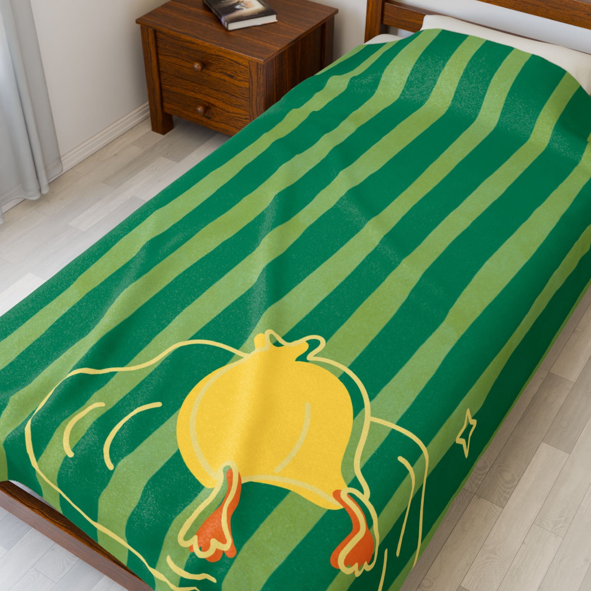 Close-up of plush blanket texture and whimsical duck print on striped background