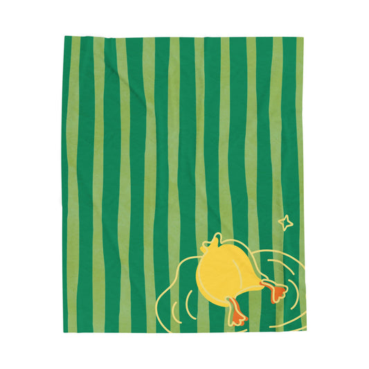 Green and yellow striped plush blanket with duck dive design styled on retro bedding for cozy comfort-core vibes