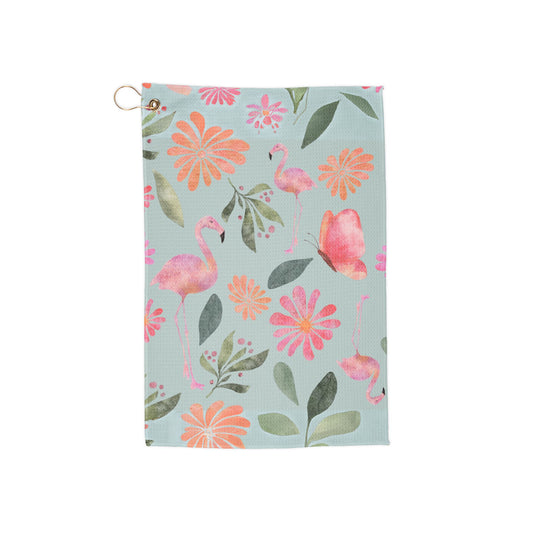 A vibrant tropical golf towel showcasing playful flamingos lounging in crystal-clear pool waters. A fun, retro-chic accessory for stylish golfers.