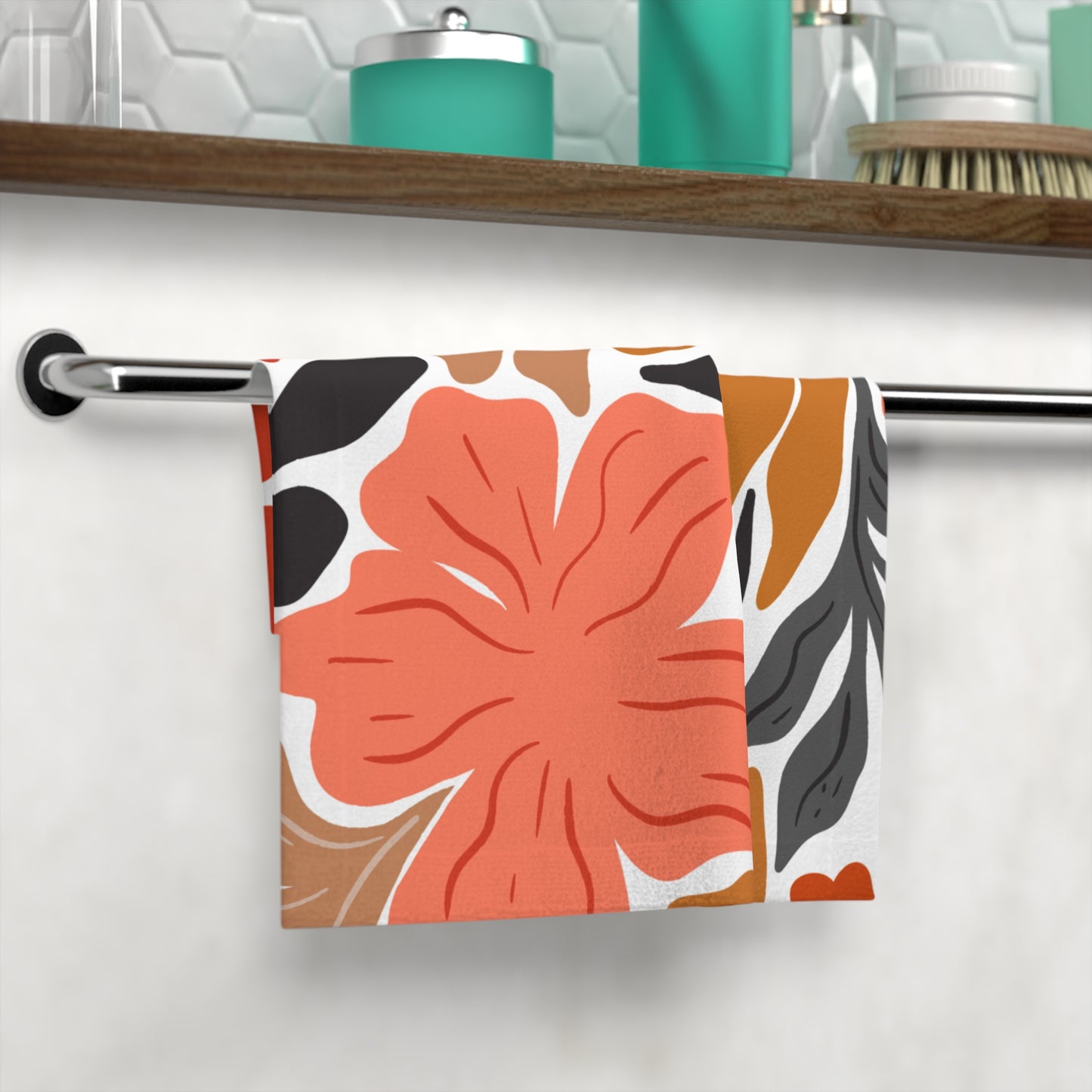 Floral towel styled in bathroom with colorful decor and skincare items