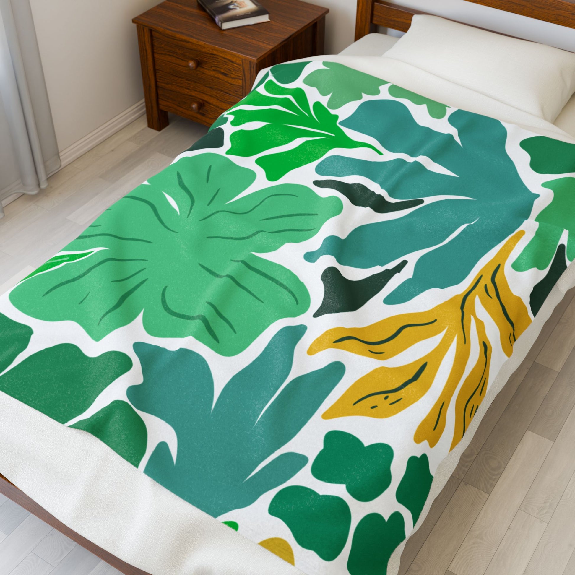 Folded plush throw blanket featuring wildflower print in vibrant tones for cozy, eccentric comfort