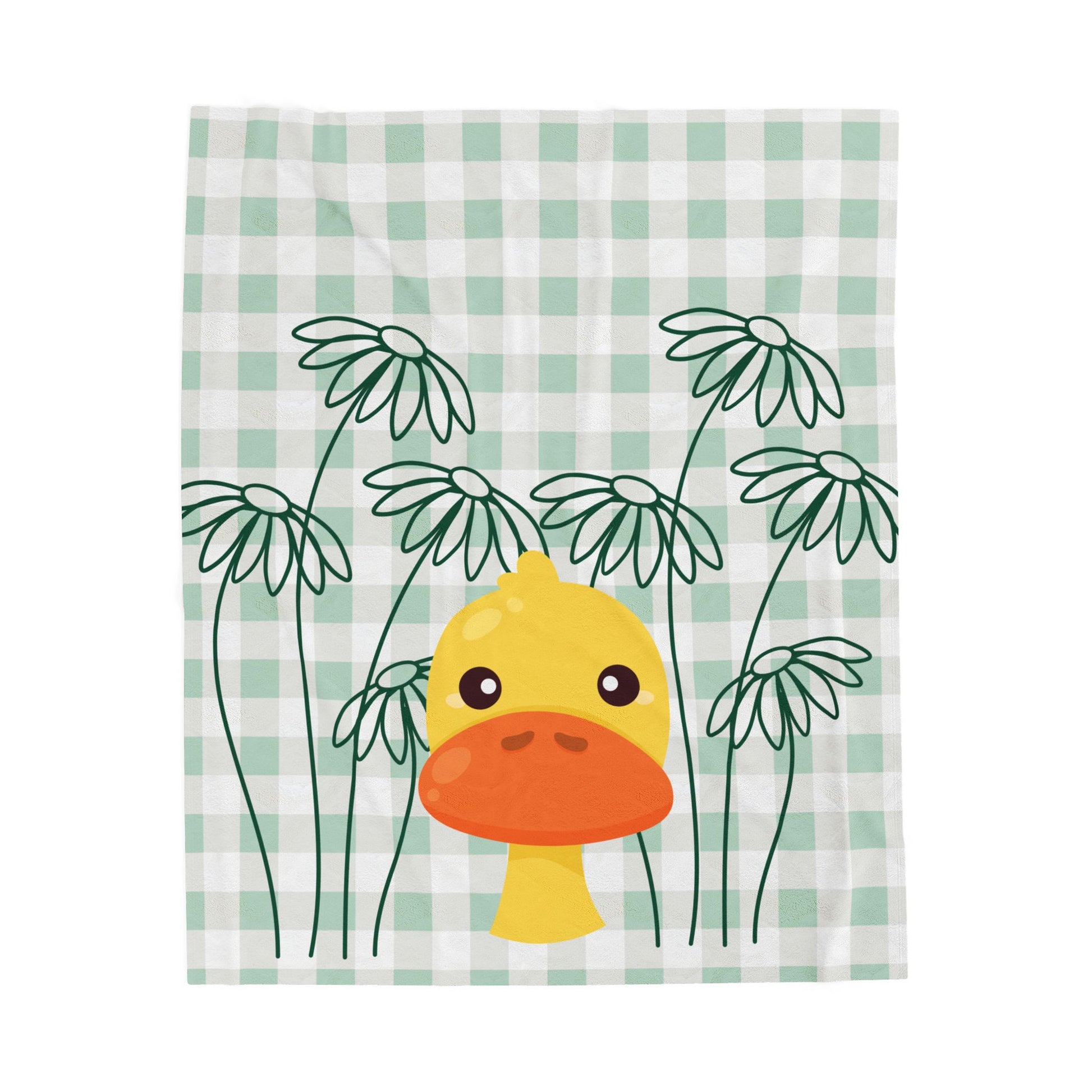 Light green plush blanket with gingham pattern, daisy accents, and duck print styled on cozy dorm bedding