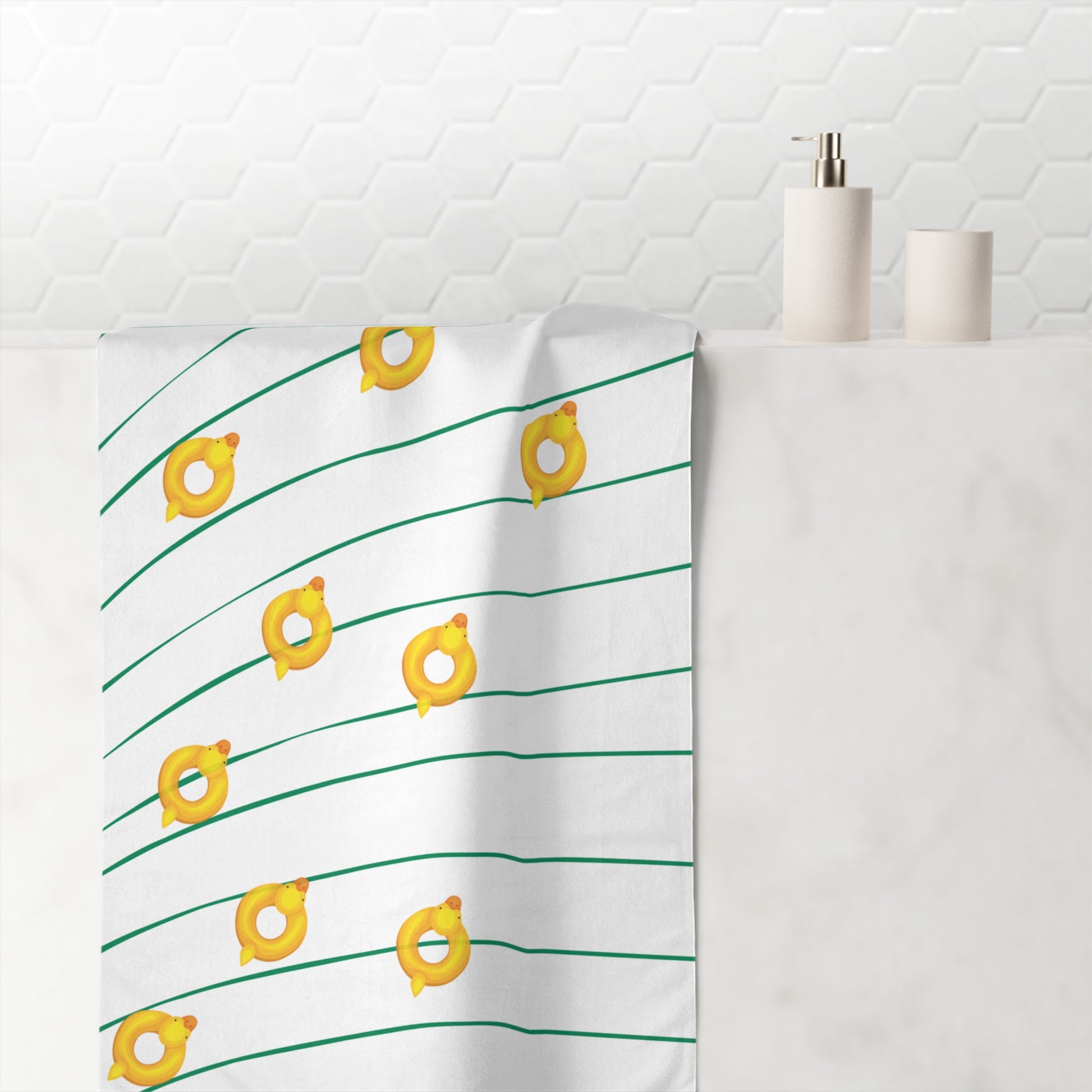 Retro beach towel featuring rubber ducky floating on bold green and gold waves – quirky collegiate-inspired swim gear