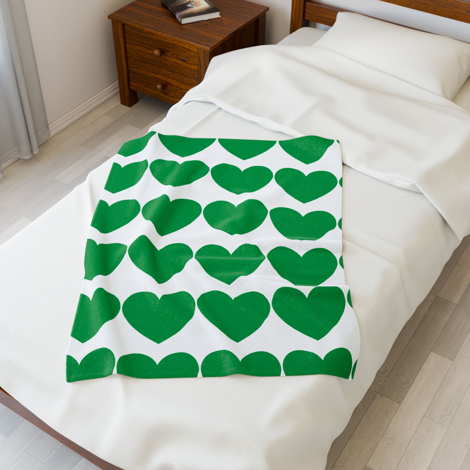 Dorm decor featuring green hearts blanket and self-care setup