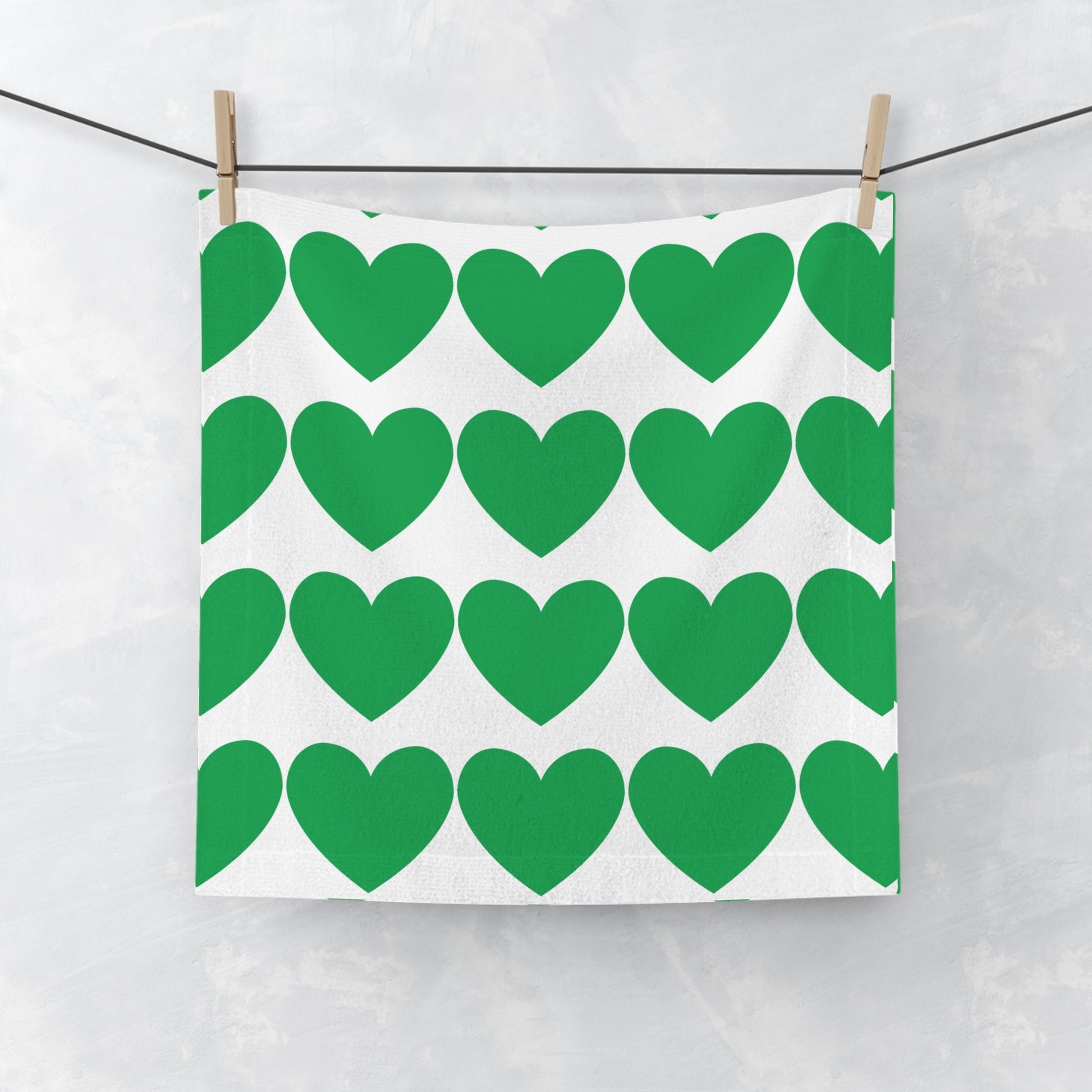 Green face towel with soft heart accents for college dorm bathroom decor