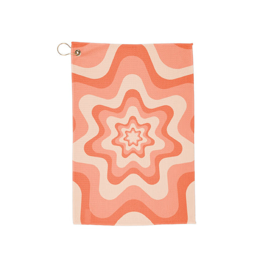 A funky 70s-inspired golf towel with bold orange stars on a swirling, vintage backdrop. Eye-catching and retro-cool for golfers with style.