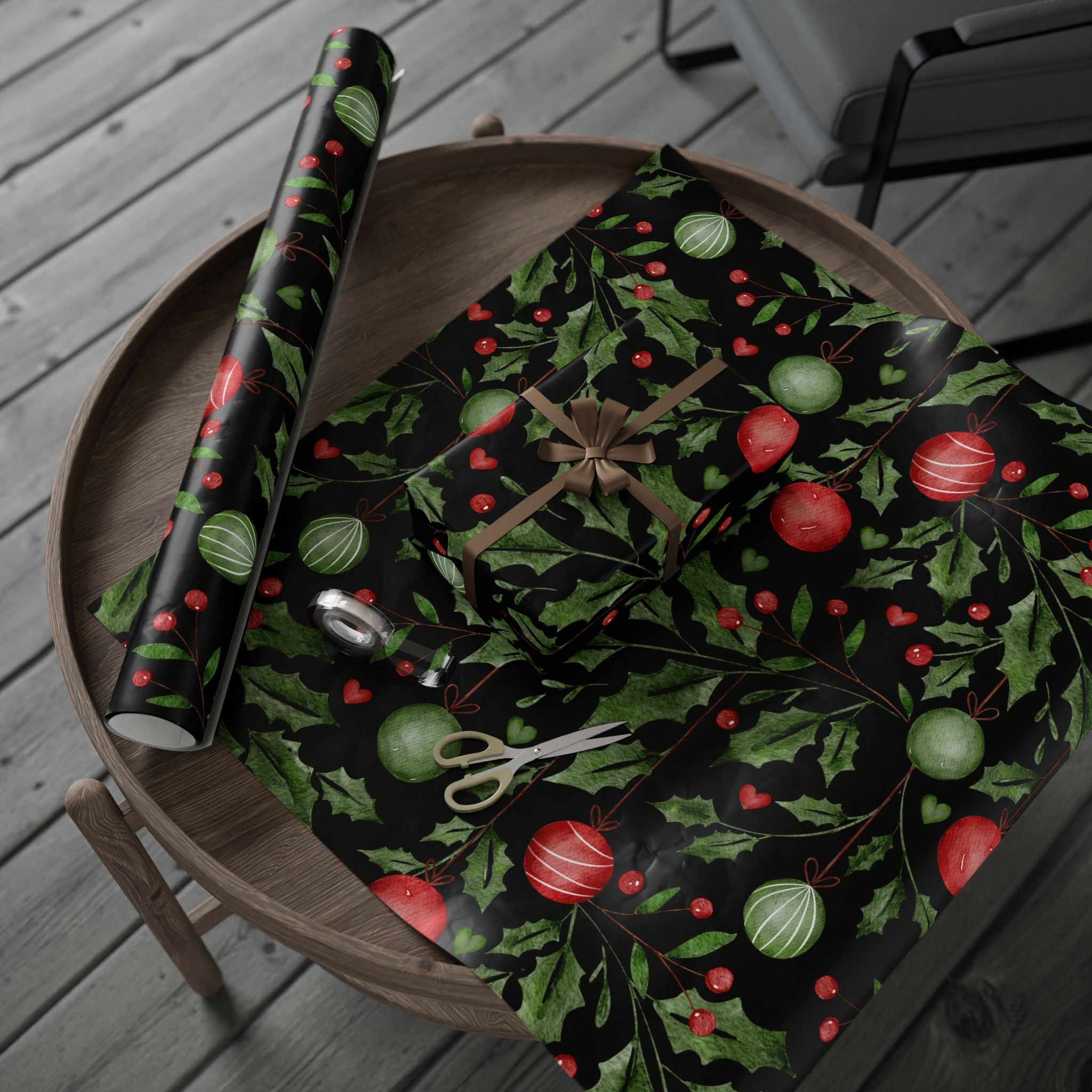 Stack of coordinated holly and berries wrapped gifts styled with classic Christmas décor.