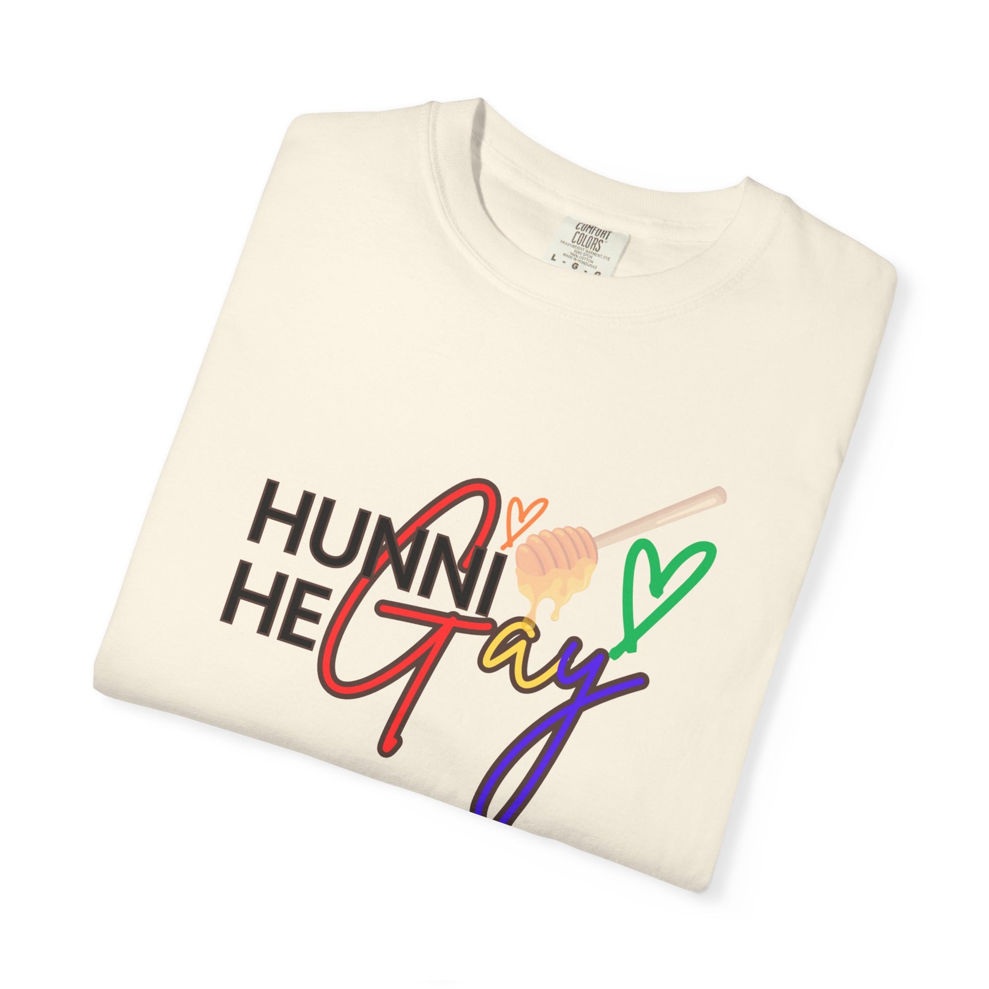 Minimalist beige "Hunni He Gay" t-shirt with colorful rainbow text, perfect for a subtle yet strong Pride expression.