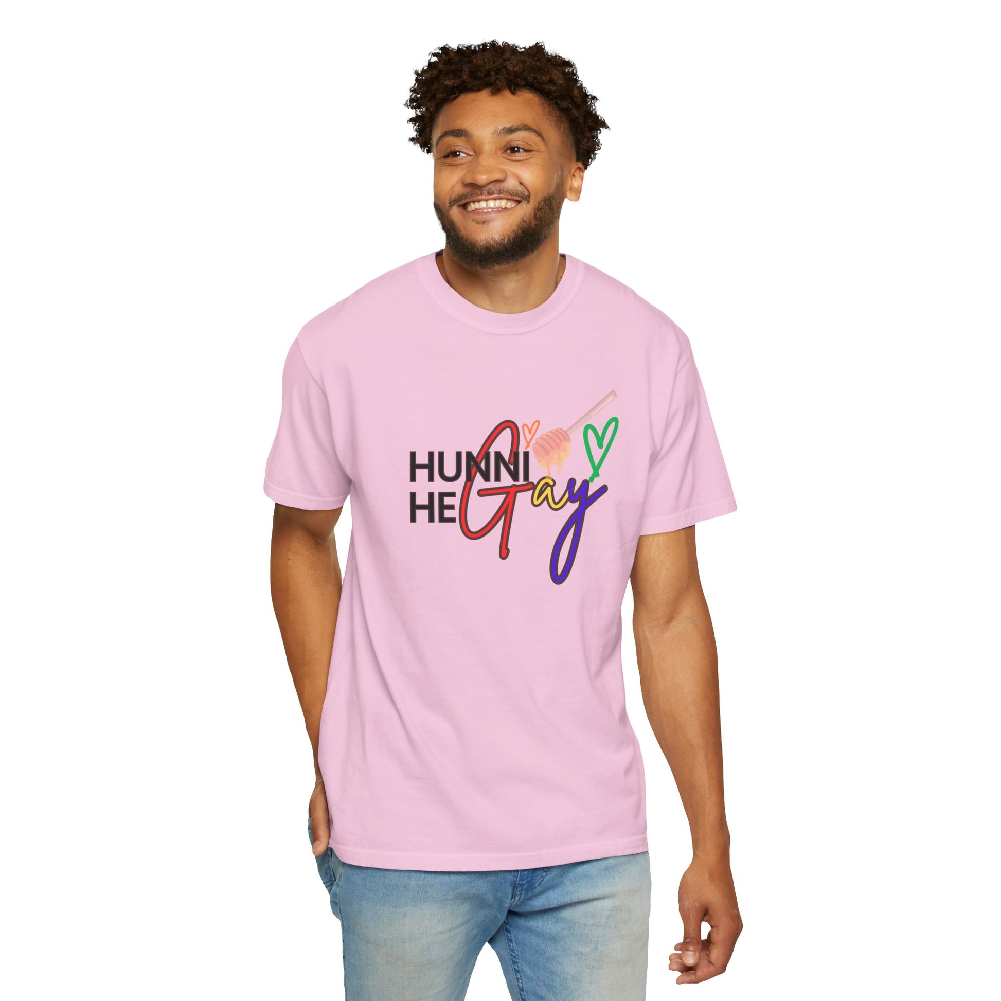 Bright pink t-shirt featuring "Hunni He Gay" in bold rainbow lettering, a playful and unapologetic Pride statement piece.