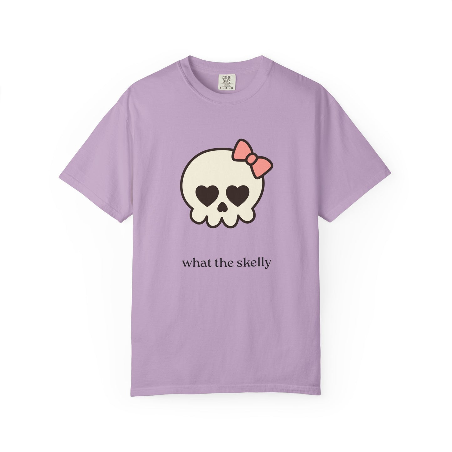 Lavender tee with QT Skelly illustration and “What the Skelly?” message, styled for whimsical spooky season fashion.