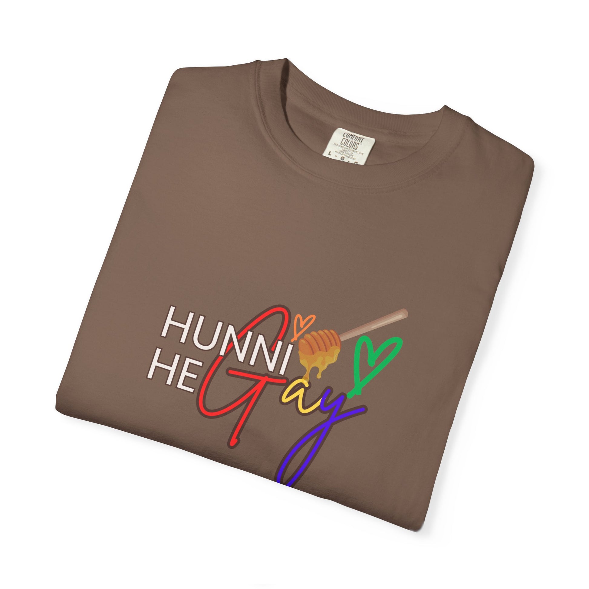Warm coffee-colored Pride t-shirt with “Hunni He Gay” printed across the chest—blending comfort and self-expression.