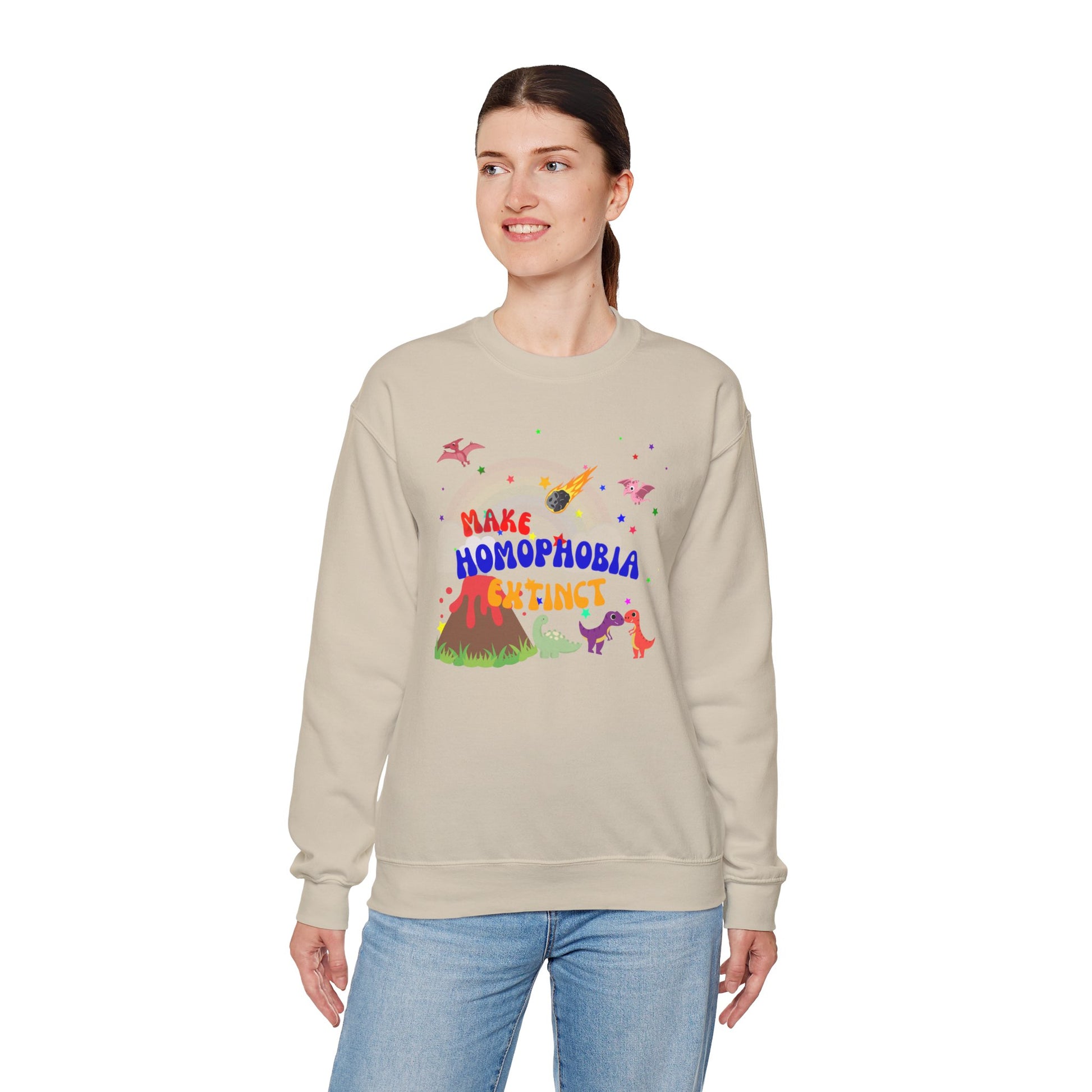 Soft beige crewneck sweatshirt featuring playful dinosaurs and “Make Homophobia Extinct” text—cozy, bold, and full of LGBTQ+ pride.
