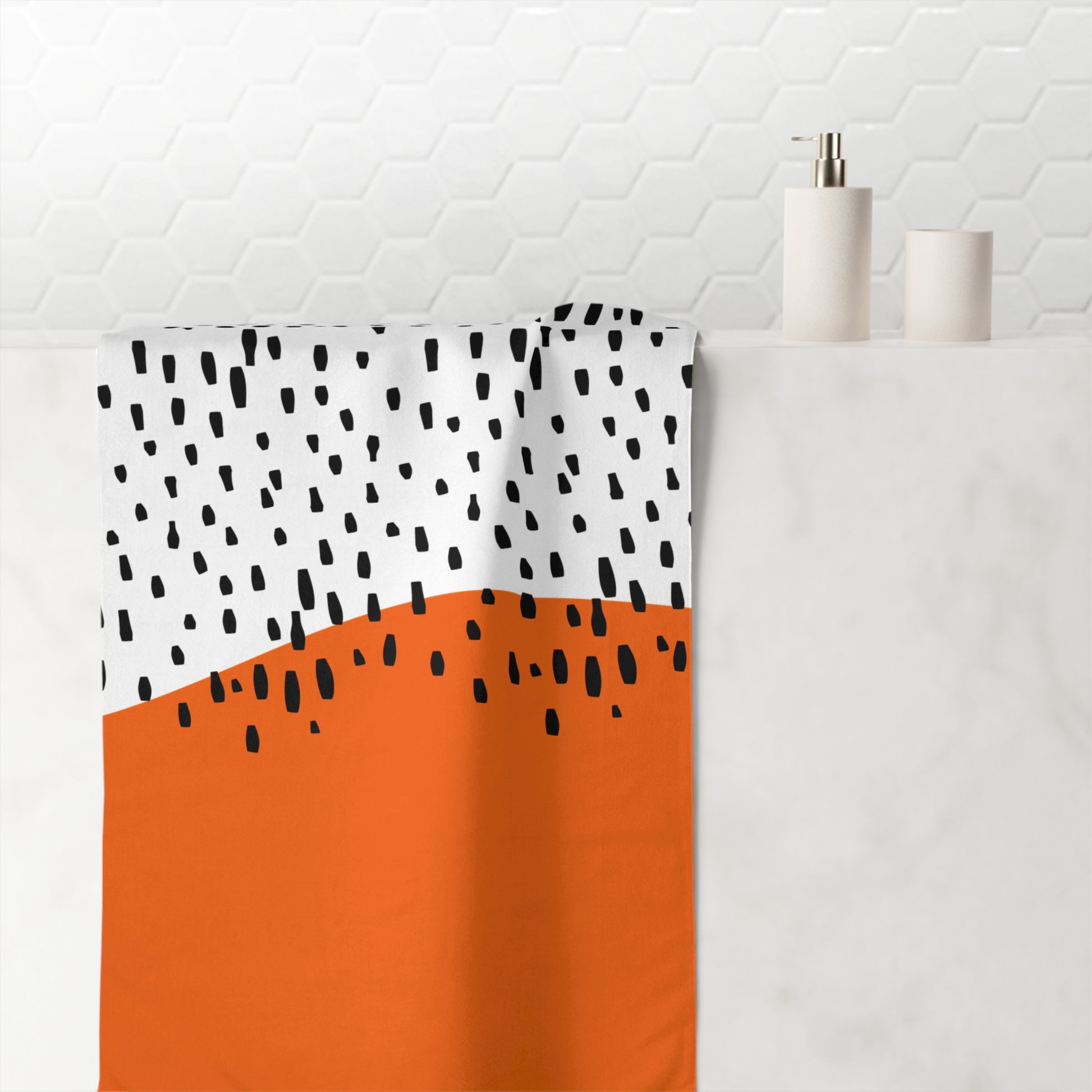 Close-up of rain pattern on orange and black towel