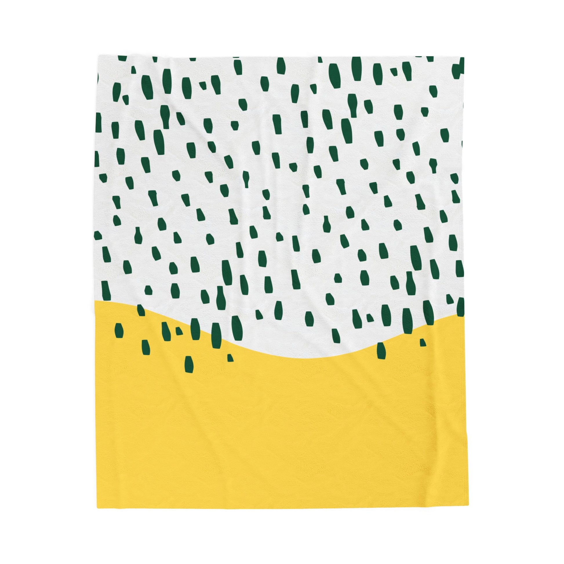 Yellow and green midcentury-style plush blanket with abstract rain pattern styled on retro bed setup