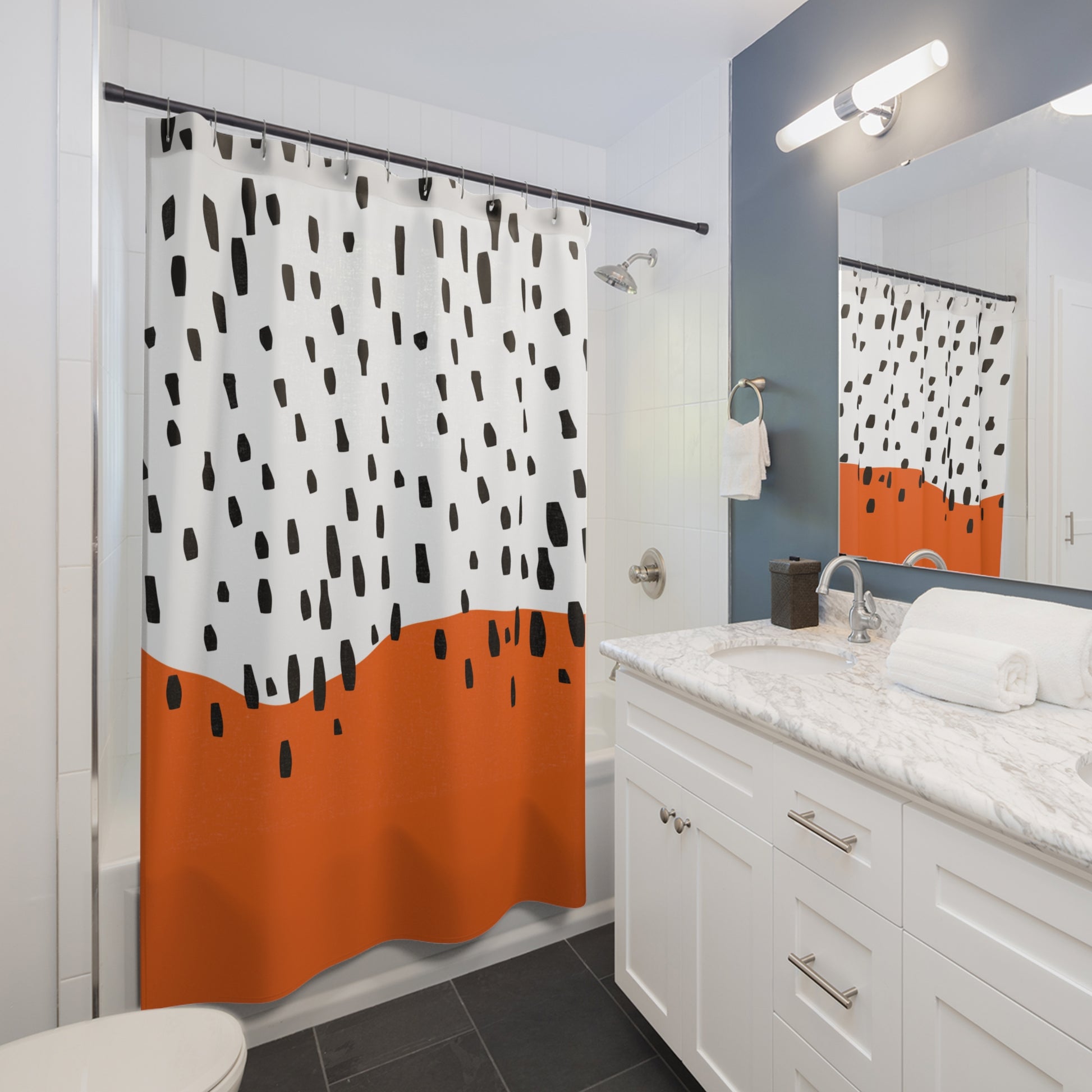 Styled bathroom scene with Mid-Century shower curtain, matte black fixtures, and wood accents