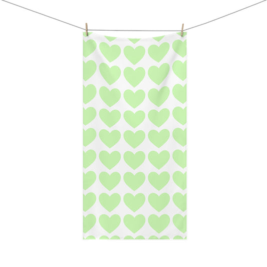 Bathroom towel featuring scattered mint green hearts – soft and whimsical decor for cozy self-care moments