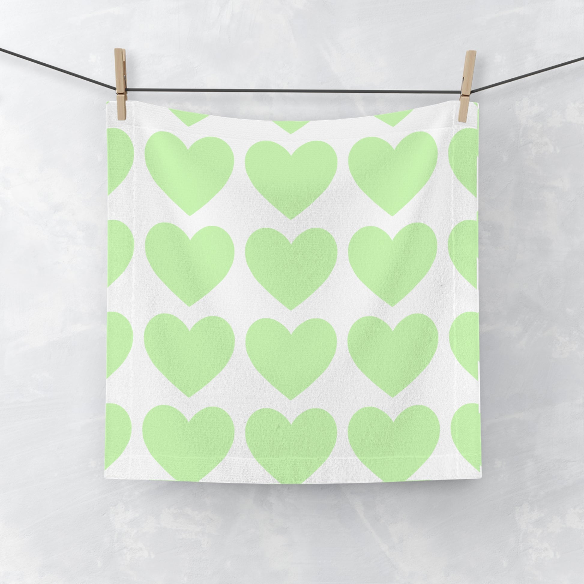 Mint face towel with heart accents, perfect for college dorm bathroom style